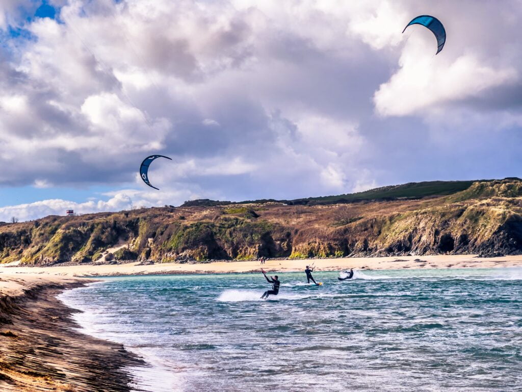 Hayle Cornwall where people are doing kitesurfing.