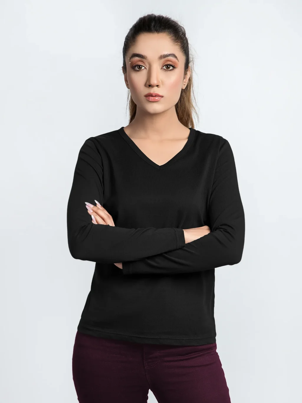 A Women wearing stylish long sleeve t-shirt with a comfortable fit and trendy design. Perfect for any casual occasion.