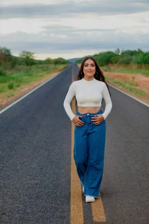 A Women wearing pair of denim pants with a wide leg cut, providing a relaxed and comfortable fit.