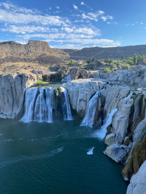 Majestic Shoshone Falls cascading in the middle of the river, creating a breathtaking natural wonder.