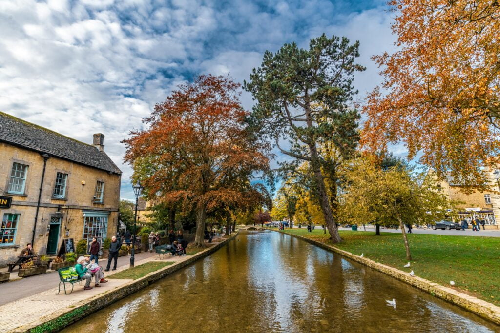 Enjoy a walking tour in Bourton-on-the-Water, highlighting beautiful bridges, delightful shops, and serene river landscapes.