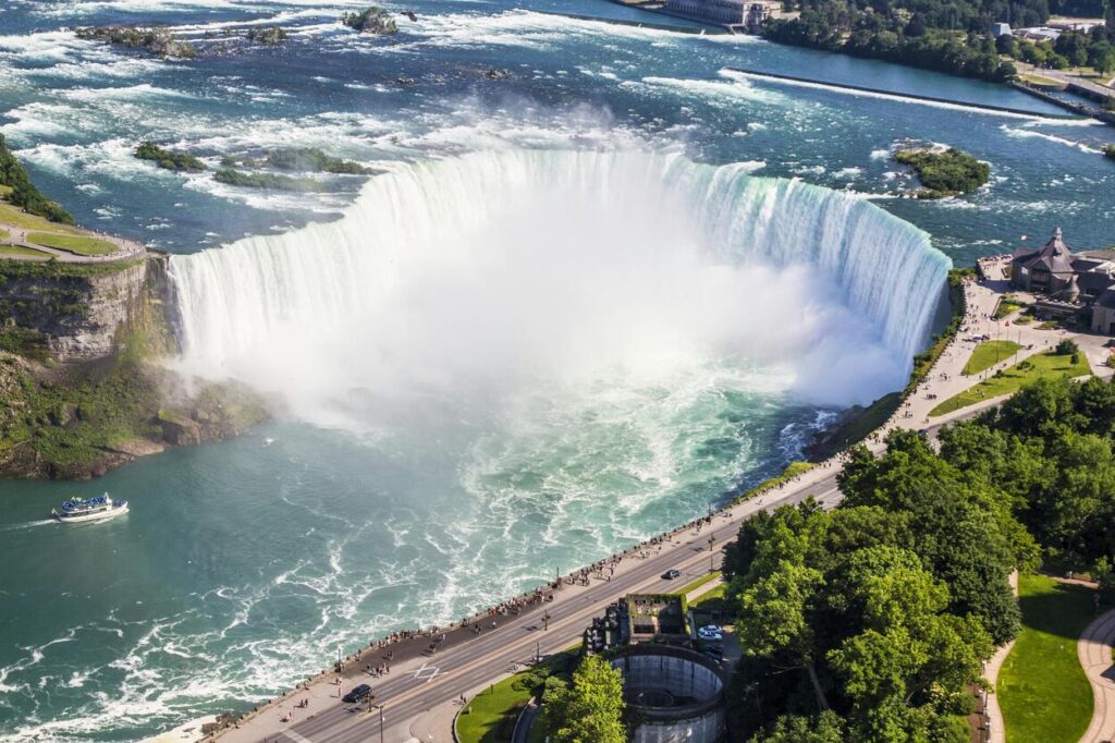 A breathtaking aerial view of Niagara Falls, showcasing the powerful cascades and lush surroundings in Canada.
