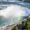 A breathtaking aerial view of Niagara Falls, showcasing the powerful cascades and lush surroundings in Canada.