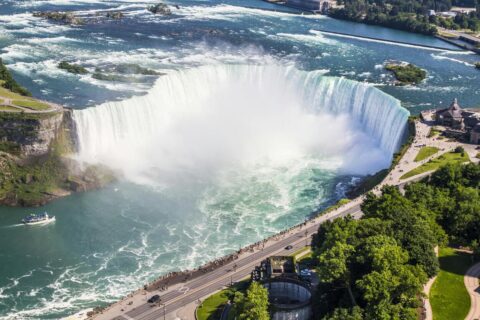 A breathtaking aerial view of Niagara Falls, showcasing the powerful cascades and lush surroundings in Canada.